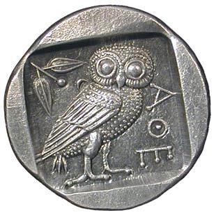 Ancient Greek silver coin, likely an Athenian tetradrachm, depicting an owl, an olive branch, and Greek letters.