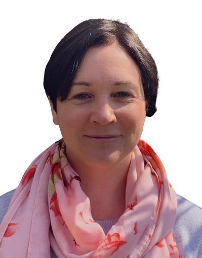 Headshot of a woman with short dark hair, wearing a pink scarf with a floral design.